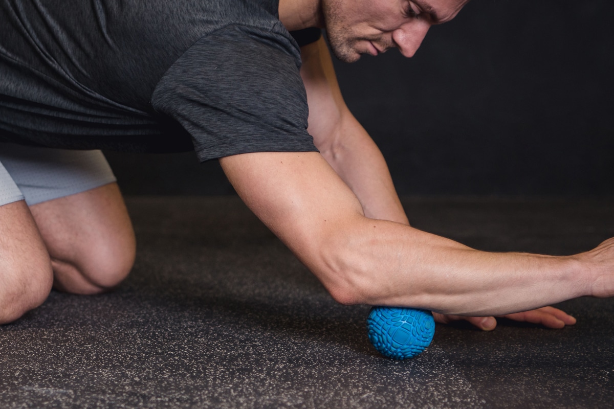 Man using roller self-care massage